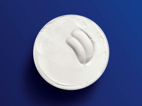 Applying NIVEA Creme to elbow highlighting brand care for rough or dry areas
