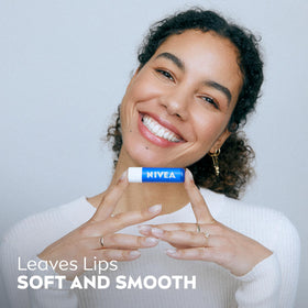 NIVEA lip balm stick open to reveal balm providing soft, protected lips
