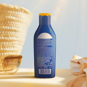 Nivea bottle in a beach bag suggesting portable protection outdoors