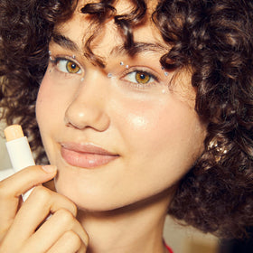 NIVEA balm being applied to lips for instant softening benefit