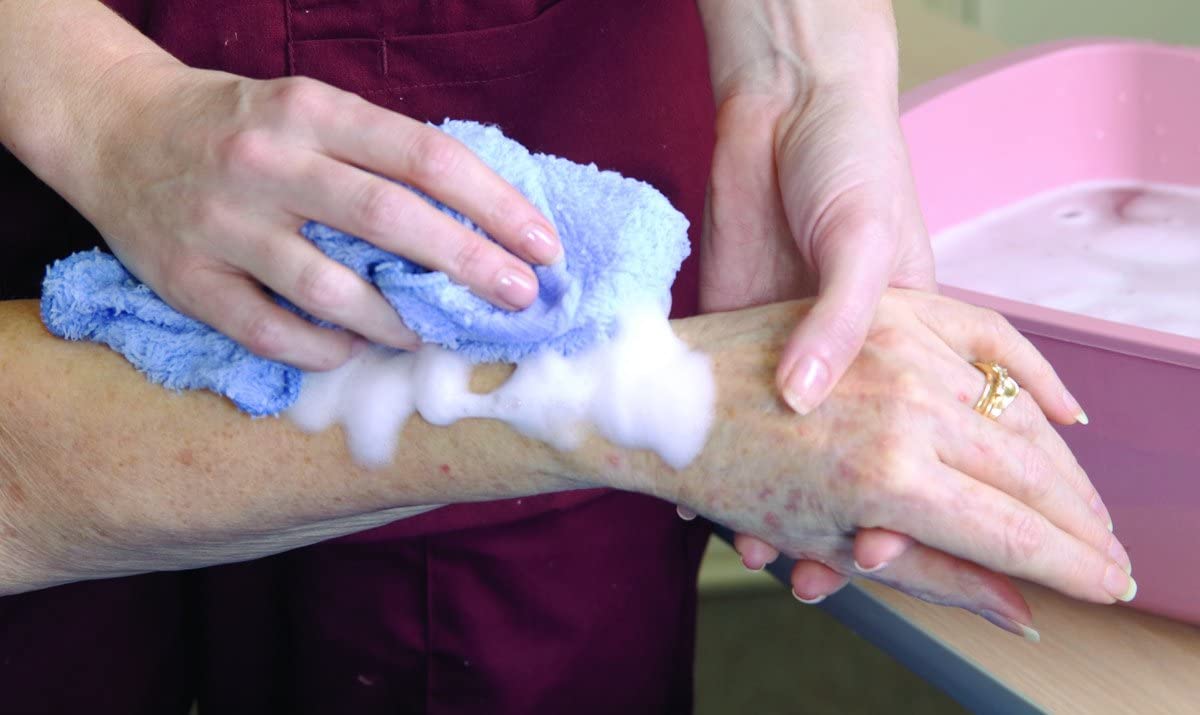 No-Rinse lotion texture on hand demonstrating easy spreadability