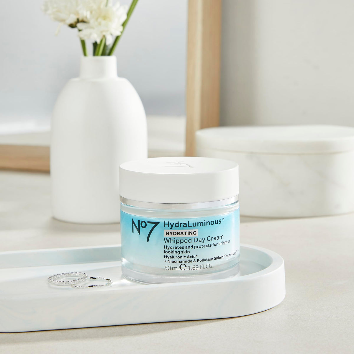 No7 being applied to cheek showing hydrating finish and makeup-ready feel