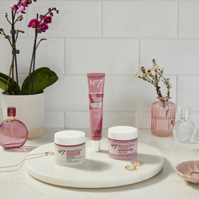 No7 used in bathroom routine with towel, evokes daily skin-firming habit