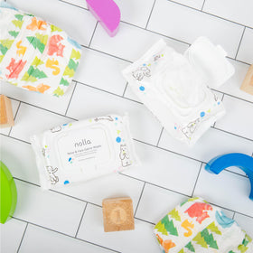 Nolla wipes placed inside a diaper bag showcasing on-the-go practicality