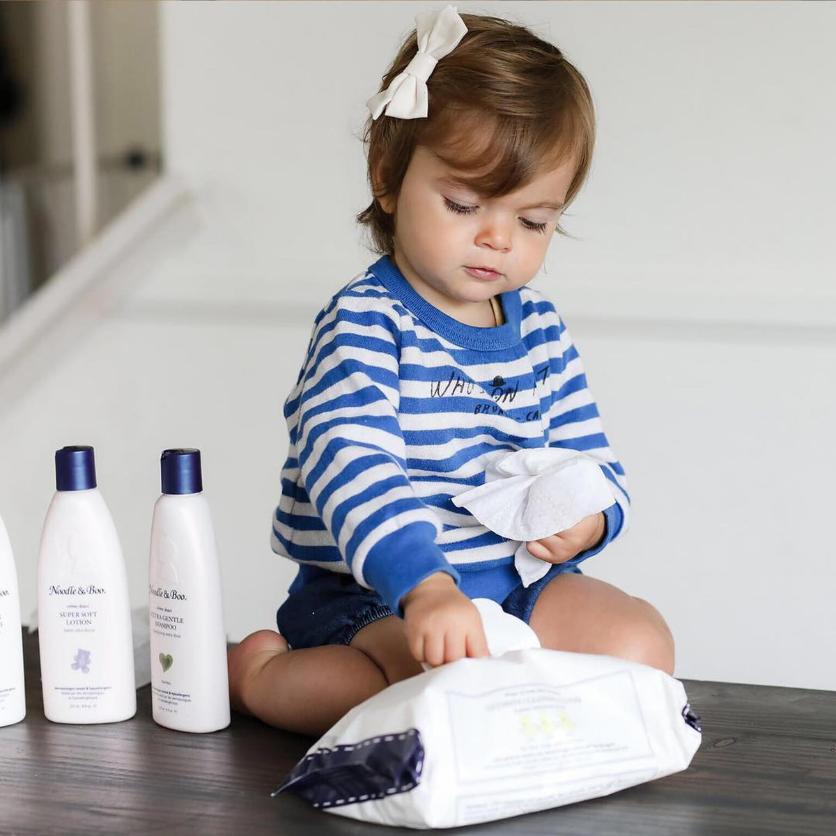 Noodle & Boo wipes in nursery scene offering convenient on-the-go care