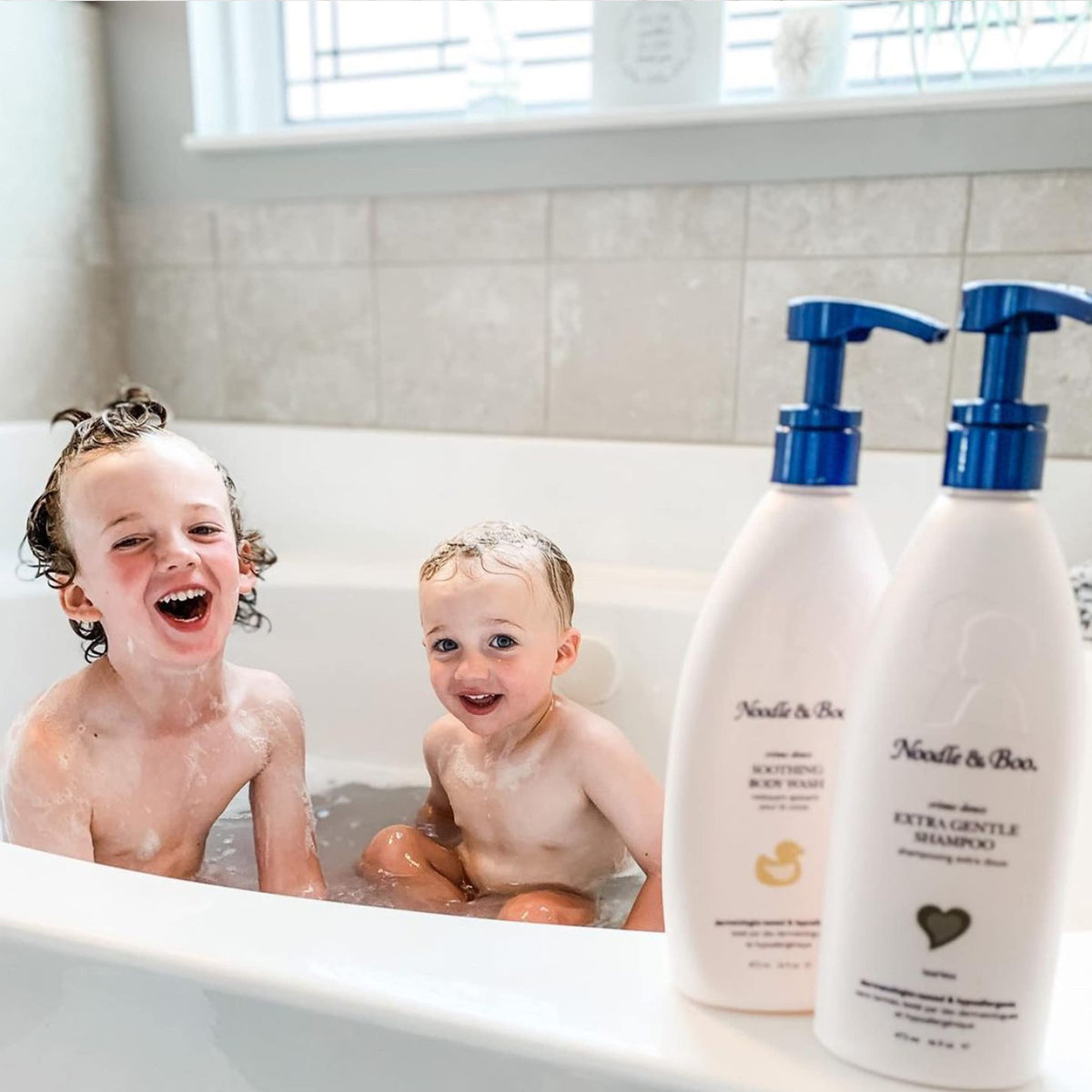 Noodle & Boo being poured into bath during baby bath time for soothing soak