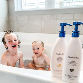 Noodle & Boo being poured into bath during baby bath time for soothing soak