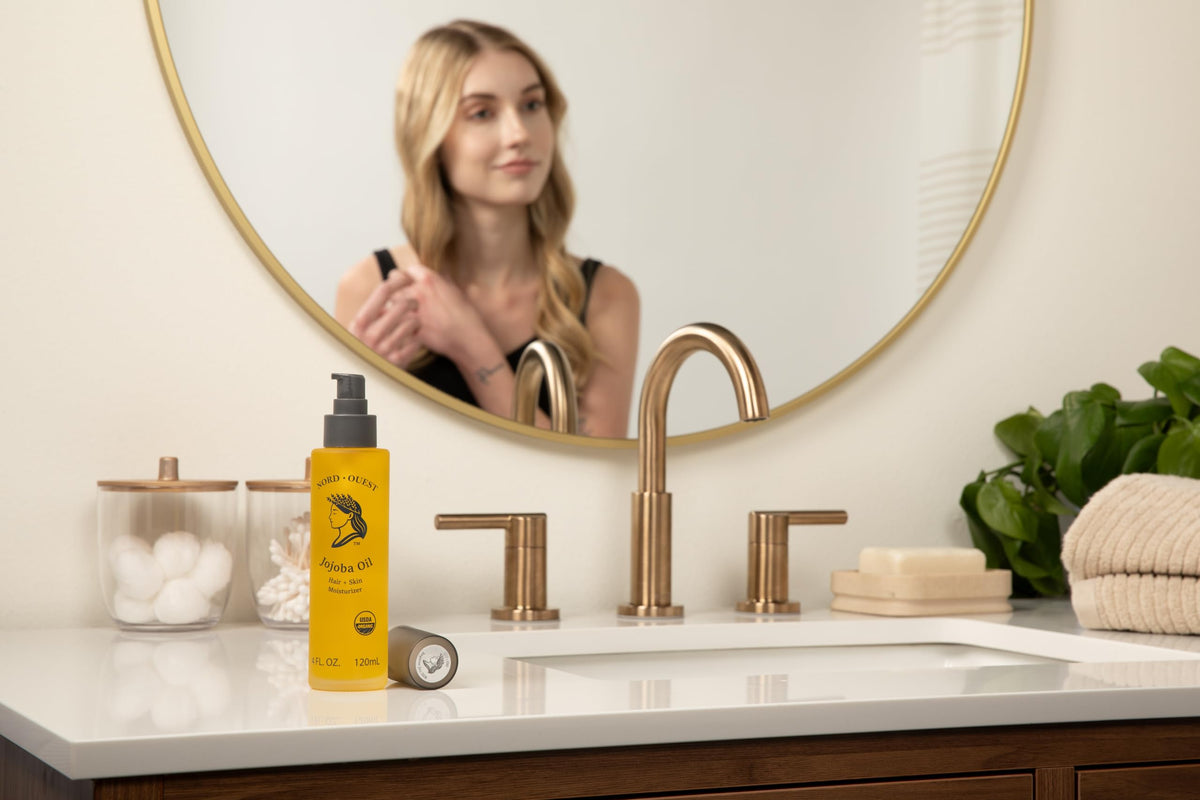Nord-Ouest bottle in hand shows 4 oz scale and portable grooming convenience