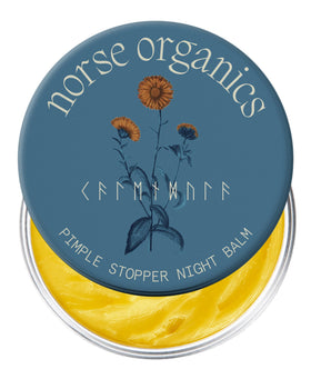 Norse Organics front packaging showing the pimple stopper night balm and benefit of calming redness