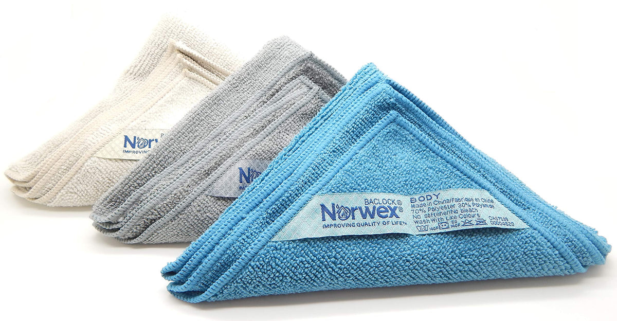 Norwex cloths inside a travel bag showing portability and quick-dry benefit