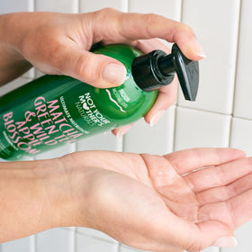 Not Your Mother's bottle close-up highlighting 75% PCR recycled-plastic packaging benefit