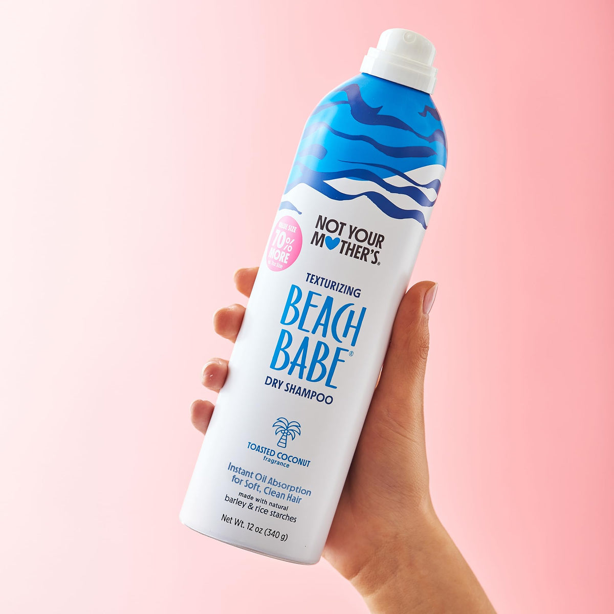 Not Your Mother's jumbo can beside a hand showing large 12 oz size value