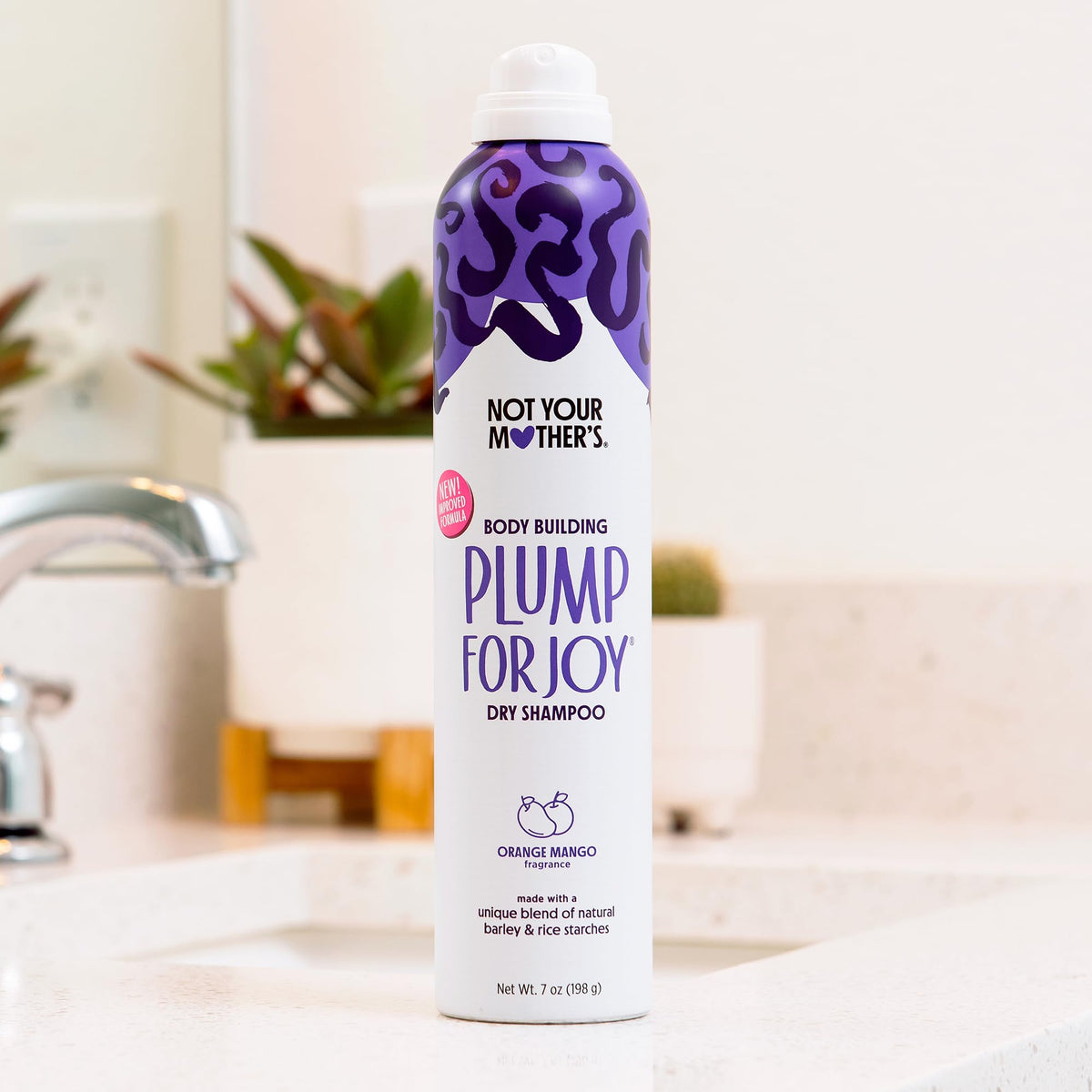Not Your Mother's being sprayed at roots in salon-style setting to show fast refresh benefit