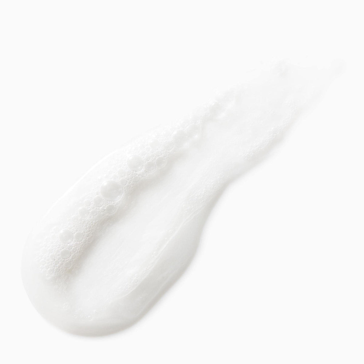 Not Your Mother's shampoo poured on hand demonstrating gentle cleansing benefit
