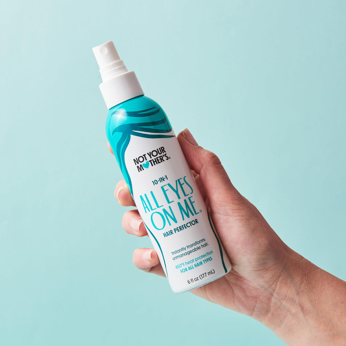 Not Your Mother's bottle in hand showing 6 fl oz scale and portability