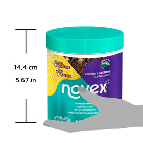 NOVEX product in use refreshing curls for defined, frizz-free shape