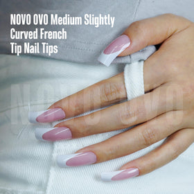 NOVO OVO next to ruler showing 26mm medium length for scale and trimability