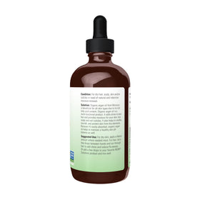 NOW Foods argan oil pouring close-up showing clear texture and easy dispensing