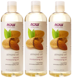 NOW Foods almond oil applied to hands in a lifestyle setting for moisturized skin