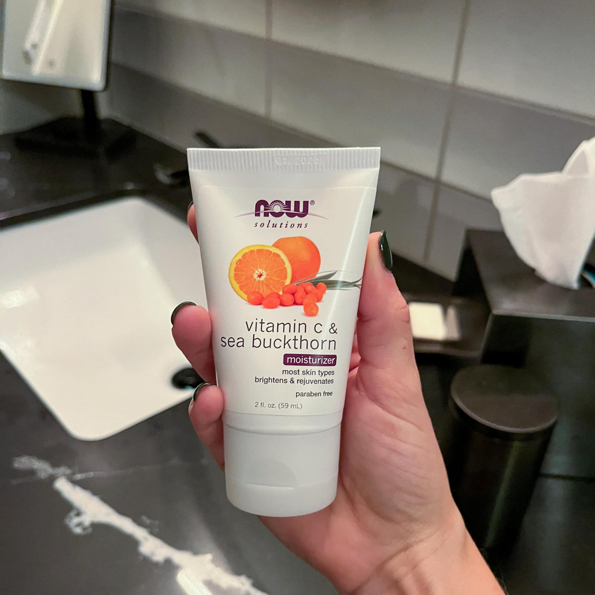 NOW Solutions cream on fingers demonstrating spreadability and easy absorption