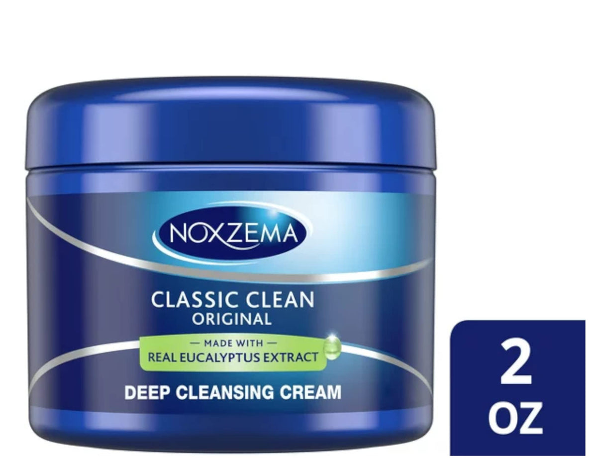 Noxzema cream dispensed on finger close detail showing rich texture and efficient coverage