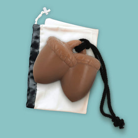 NPW soap held in hand for size comparison demonstrating long-lasting 9.2-ounce benefit