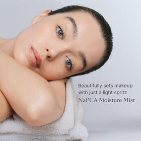 Nu Skin mist applied to hands and arms showing smooth non-greasy finish