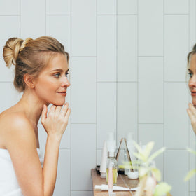 Nu Skin jar on bathroom counter in routine setting, implies daily use benefit
