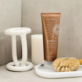 Nu Skin Sunright applied with mitt on arm demonstrating even blend and streak-free benefit