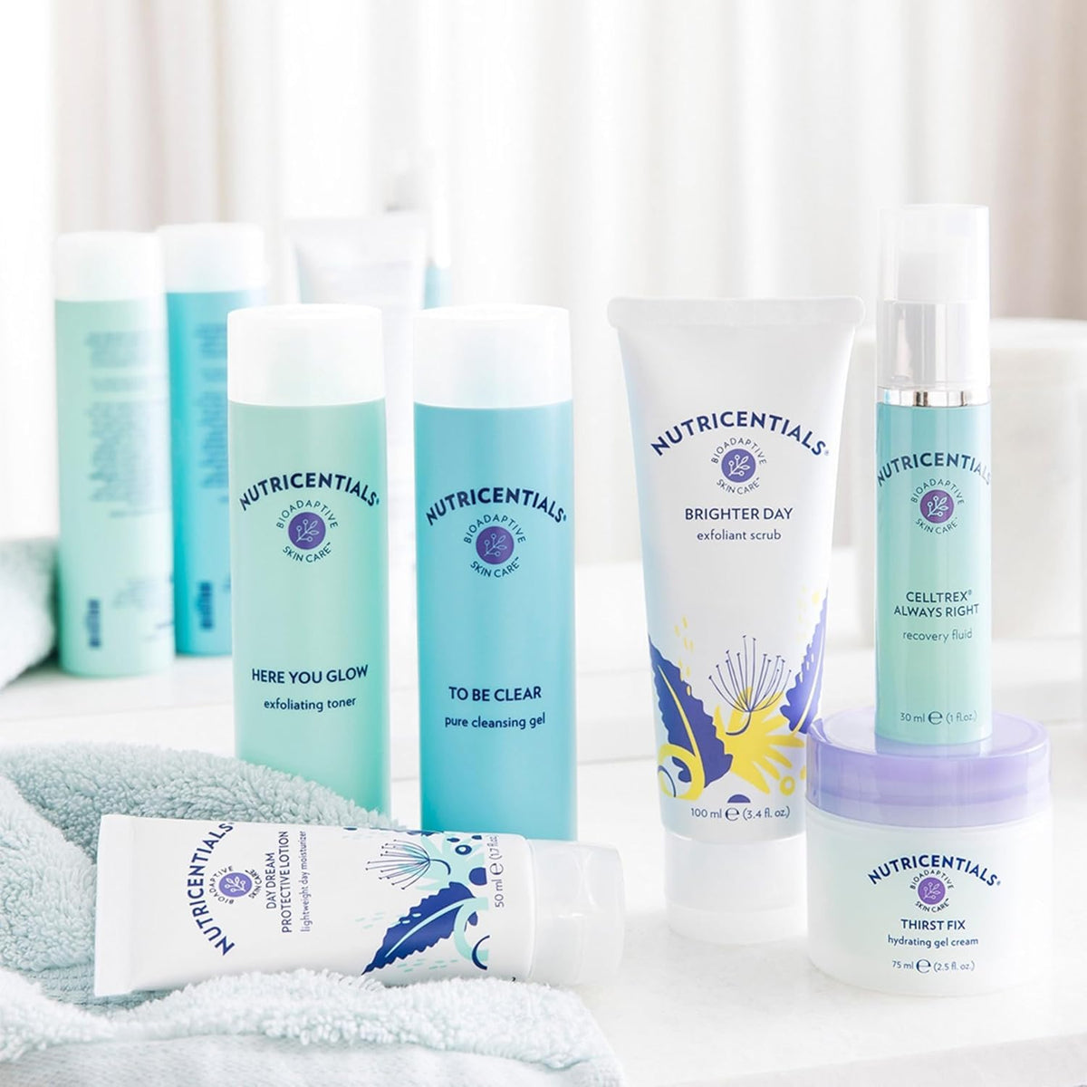 Nu Skin ThirstFix placed on bathroom shelf with towel for everyday routine inspiration and balance