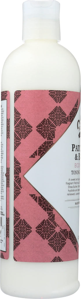 Nubian Heritage 13 fl oz bottle held in hand showing travel-ready benefit