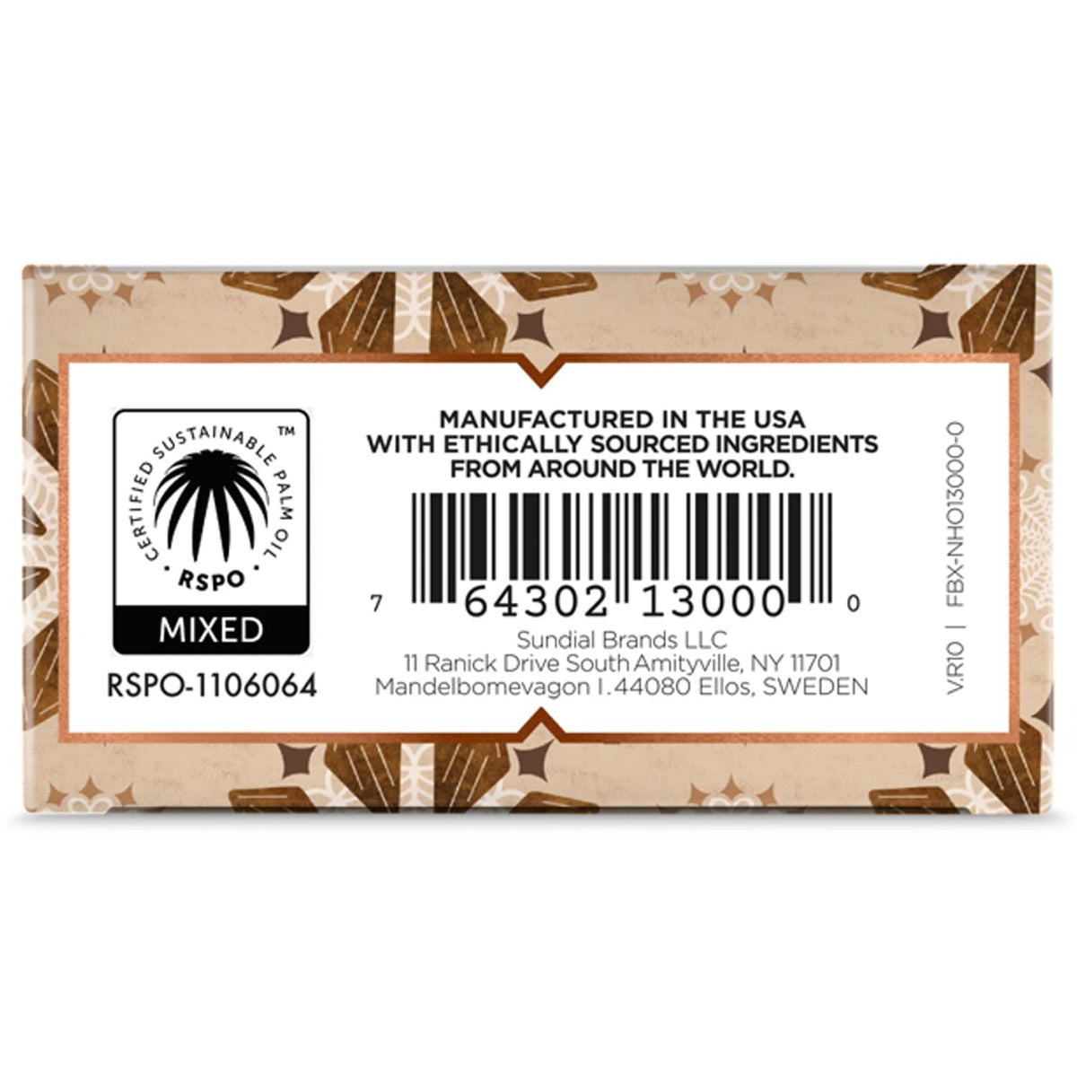 Nubian Heritage bar lathered in hand over sink demonstrating gentle hydration and warm scent