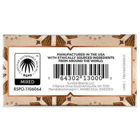 Nubian Heritage bar lathered in hand over sink demonstrating gentle hydration and warm scent