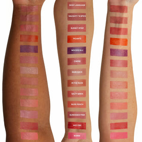Nudestix recyclable tin open to show packaging and portability benefit