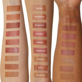 Nudestix applying bronzer to cheek for natural contour and warmth