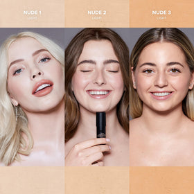 Nudestix stick beside bag highlighting portable touch-up convenience