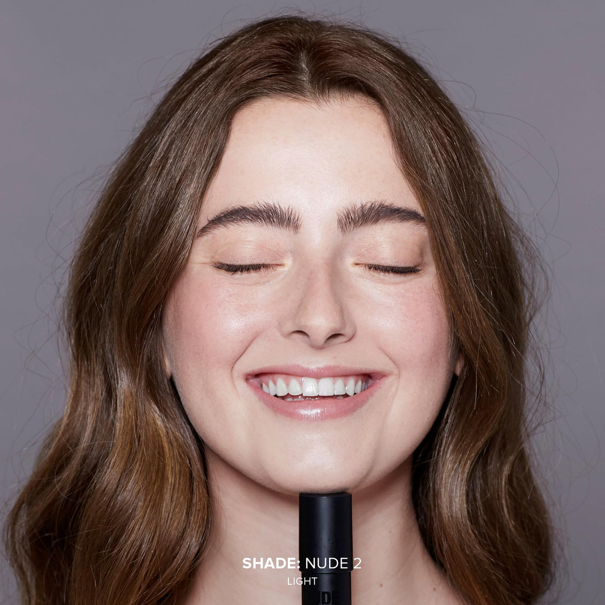 Nudestix texture close-up demonstrating cream-to-powder finish and smooth feel