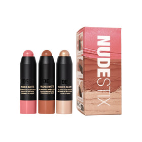Nudestix front tin view showing compact travel kit and three sticks for easy touch-ups