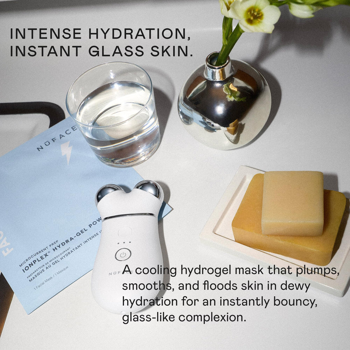 NuFACE hand massaging remaining serum into skin for added glow