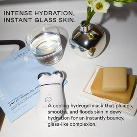 NuFACE hand massaging remaining serum into skin for added glow