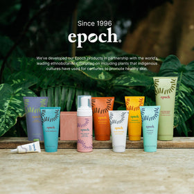 Nu Skin body butter on vanity next to towel conveying pampering routine and skin comfort