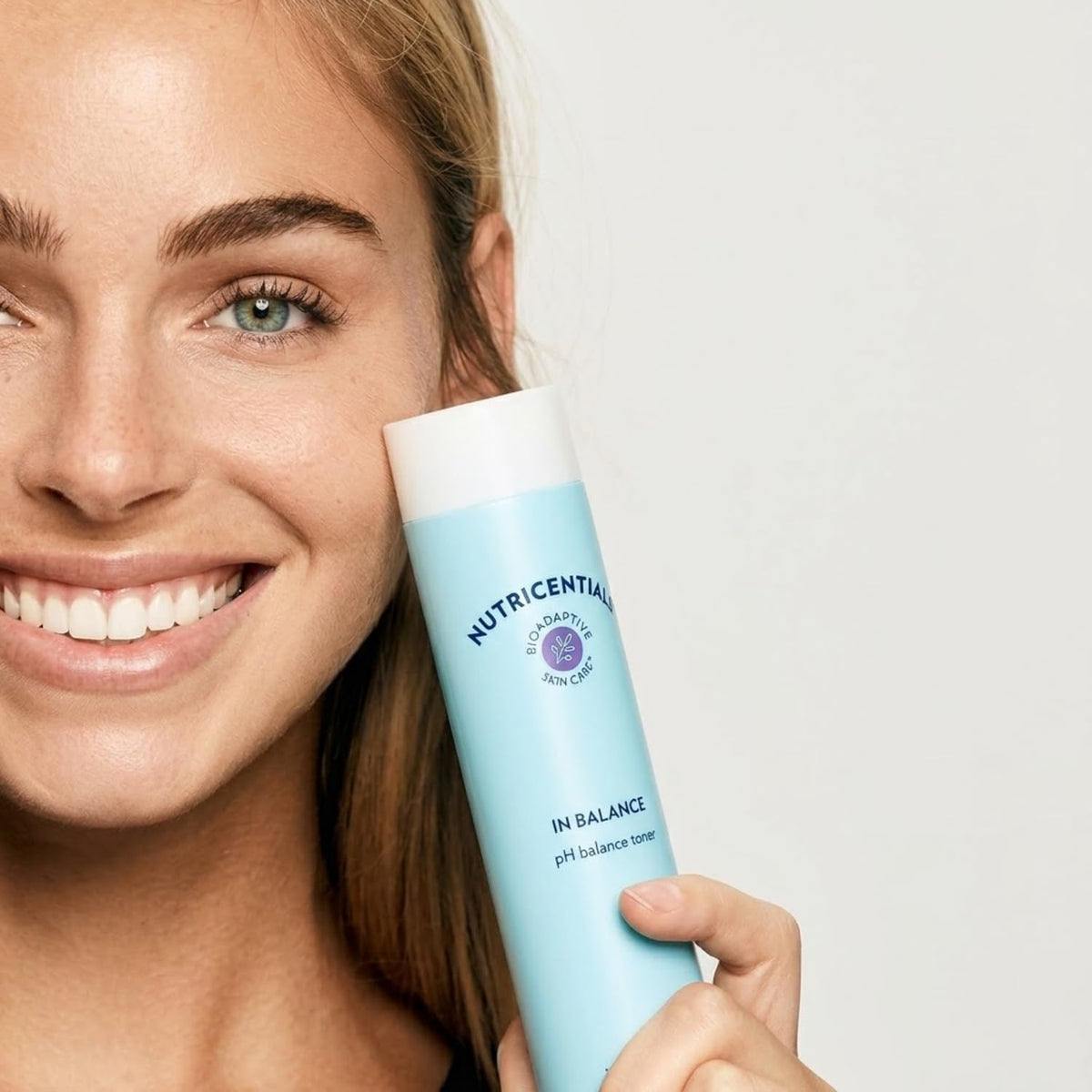 Nu Skin bottle texture close-up highlighting liquid clarity and hydration