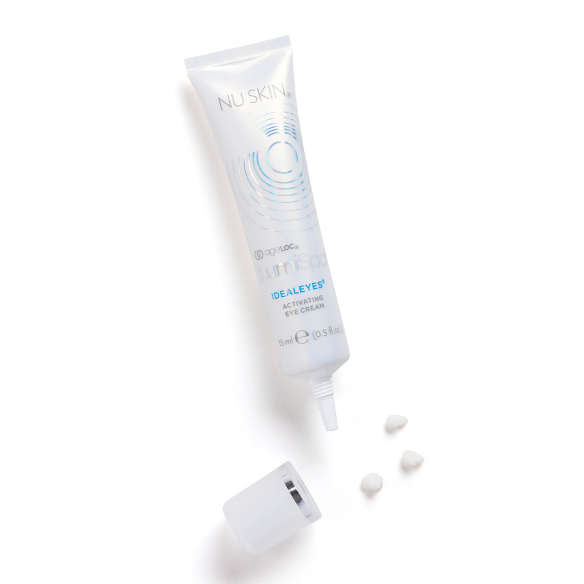 Nu Skin IdealEyes cream on finger close-up illustrating smooth texture for precise application