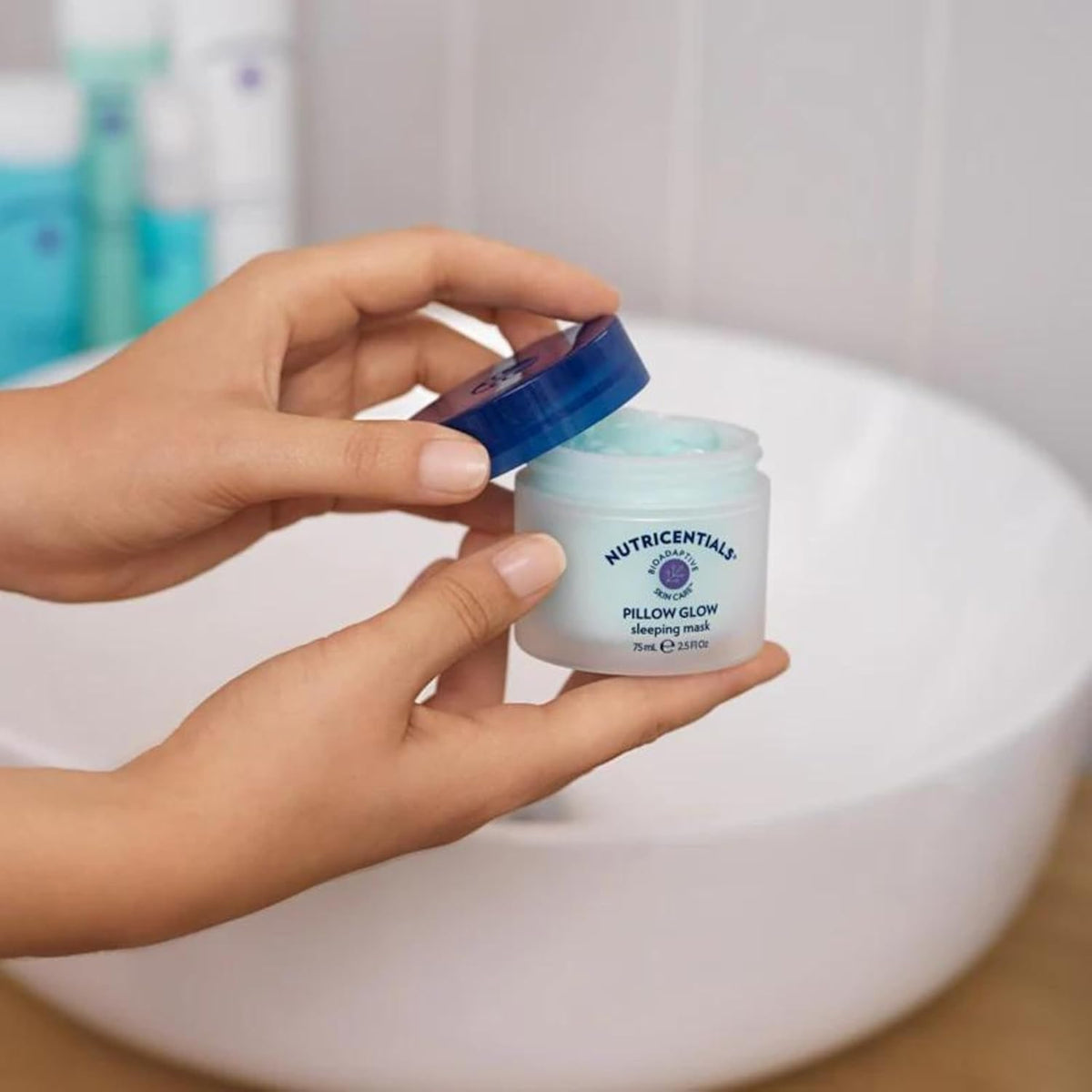 Nu Skin Pillow Glow applied to hand illustrating spreadability and non-greasy finish