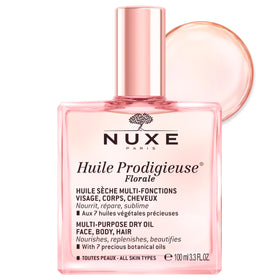 NUXE bottle front view showing elegant glass and floral label, highlighting brand luxury