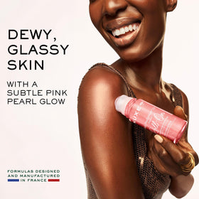 NUXE shimmering oil texture pooled to show pink‑gold iridescence and nourishing finish