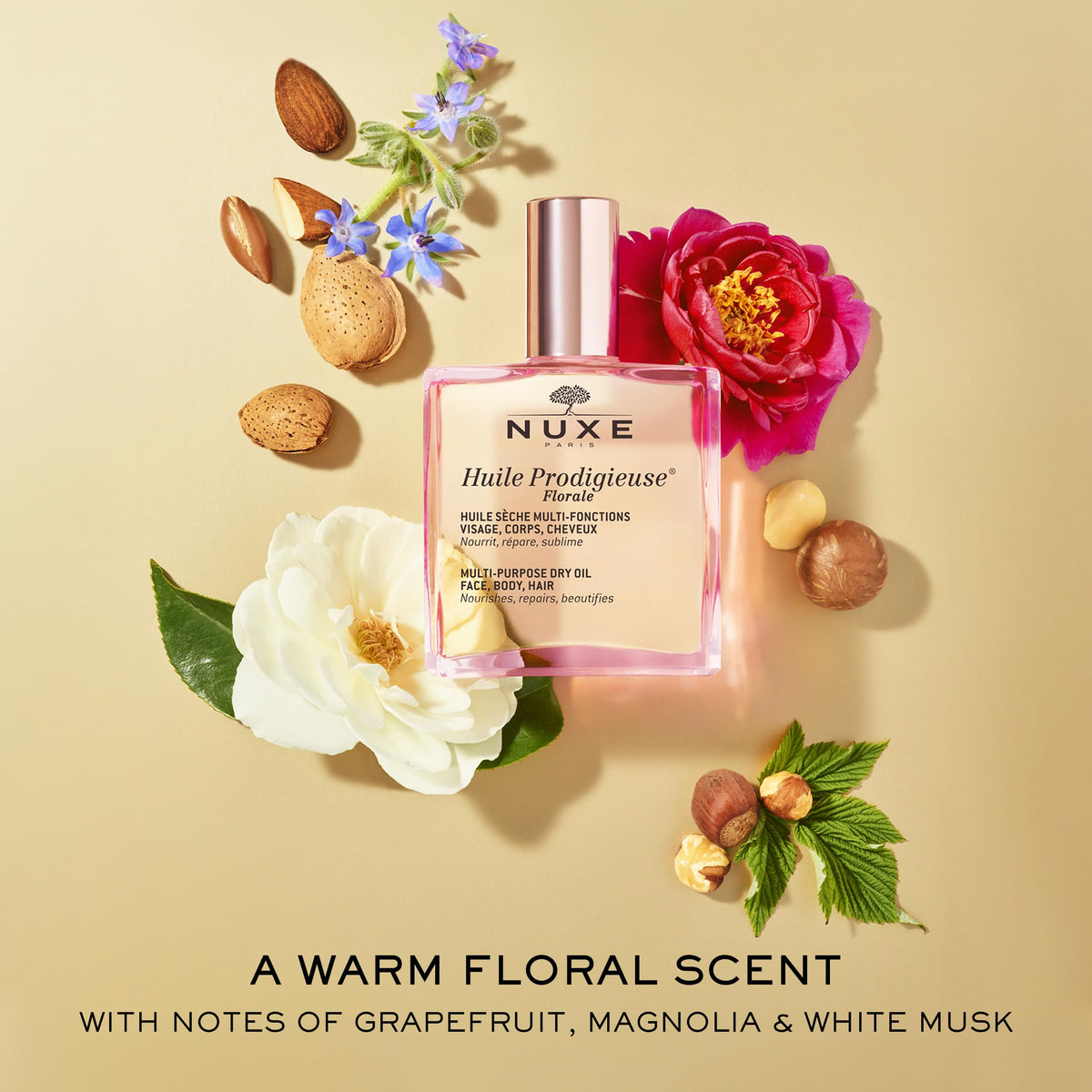 NUXE bottle with botanical oils flatlay emphasizing nourishing ingredients benefit