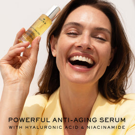 NUXE Super Serum dropper dispensing clear serum, demonstrates precise application benefit