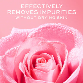NUXE bottle held in hand to show 5 fl oz size and travel-friendly benefit