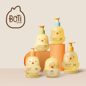 O Boticário bottle next to baby toy showing 200ml scale for portion planning